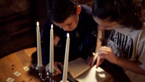Two young children playing escape rooms in Powys